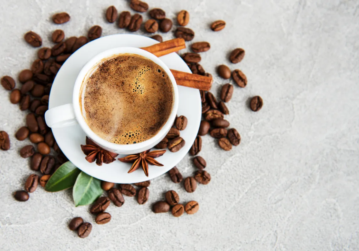 Coffee with coffee beans scattered