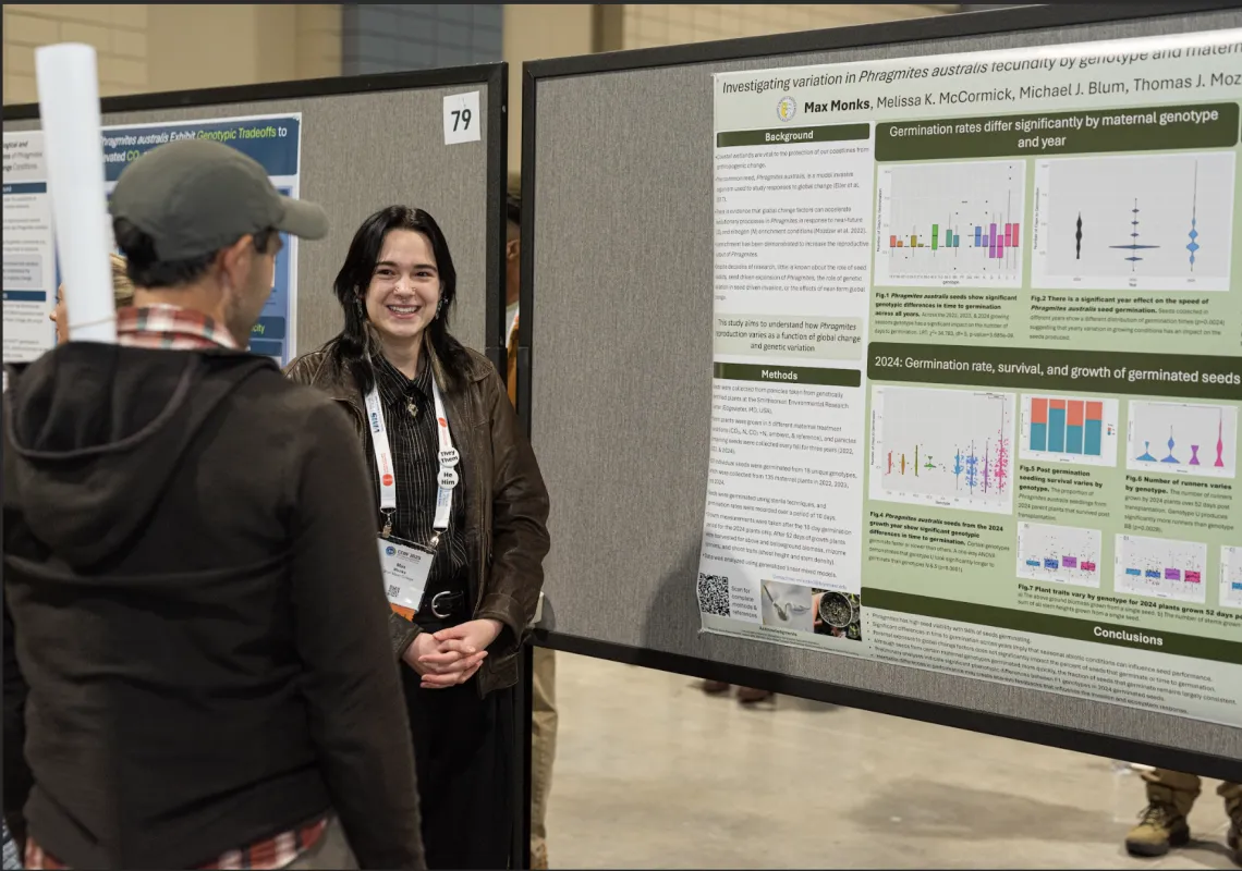 Max Monks presenting poster at conference 2025