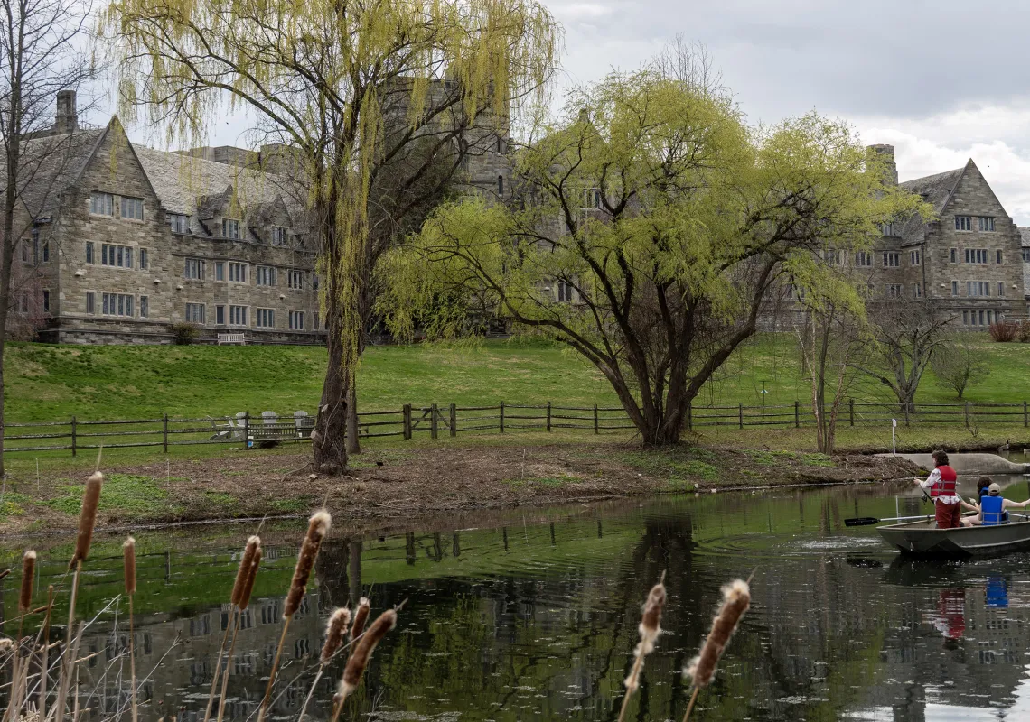 student in a boat on a lake