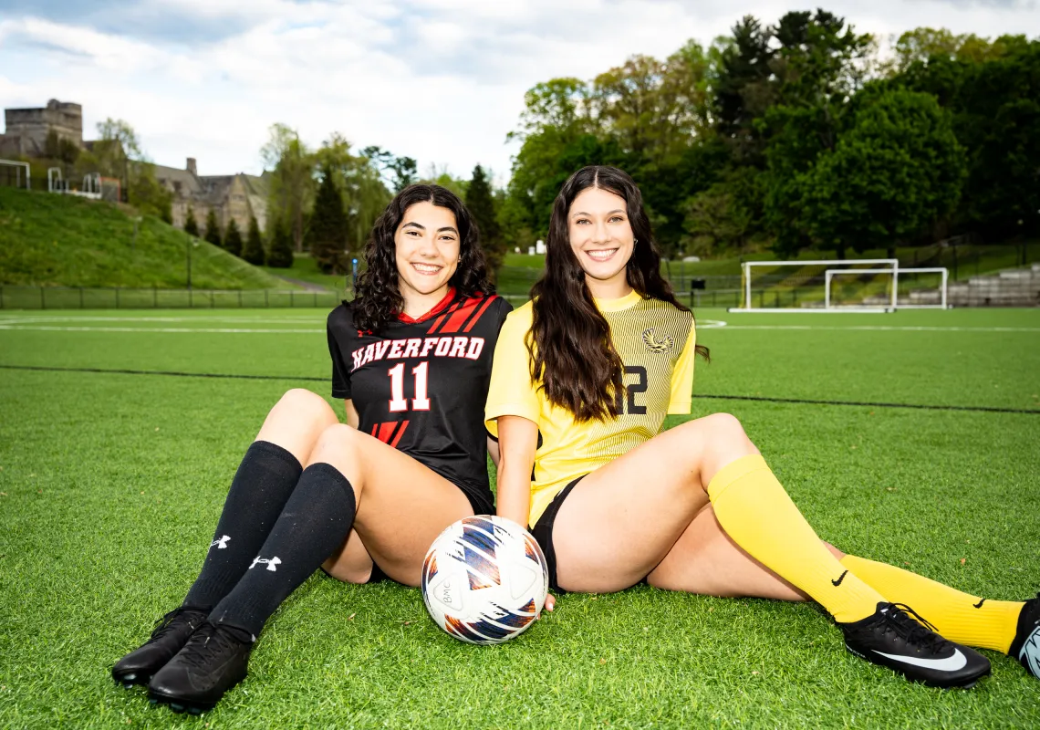 Twin sisters with a soccer ball