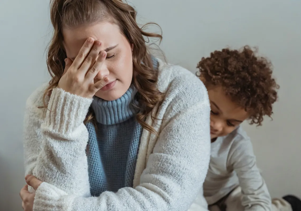 Overwhelmed mother w/child