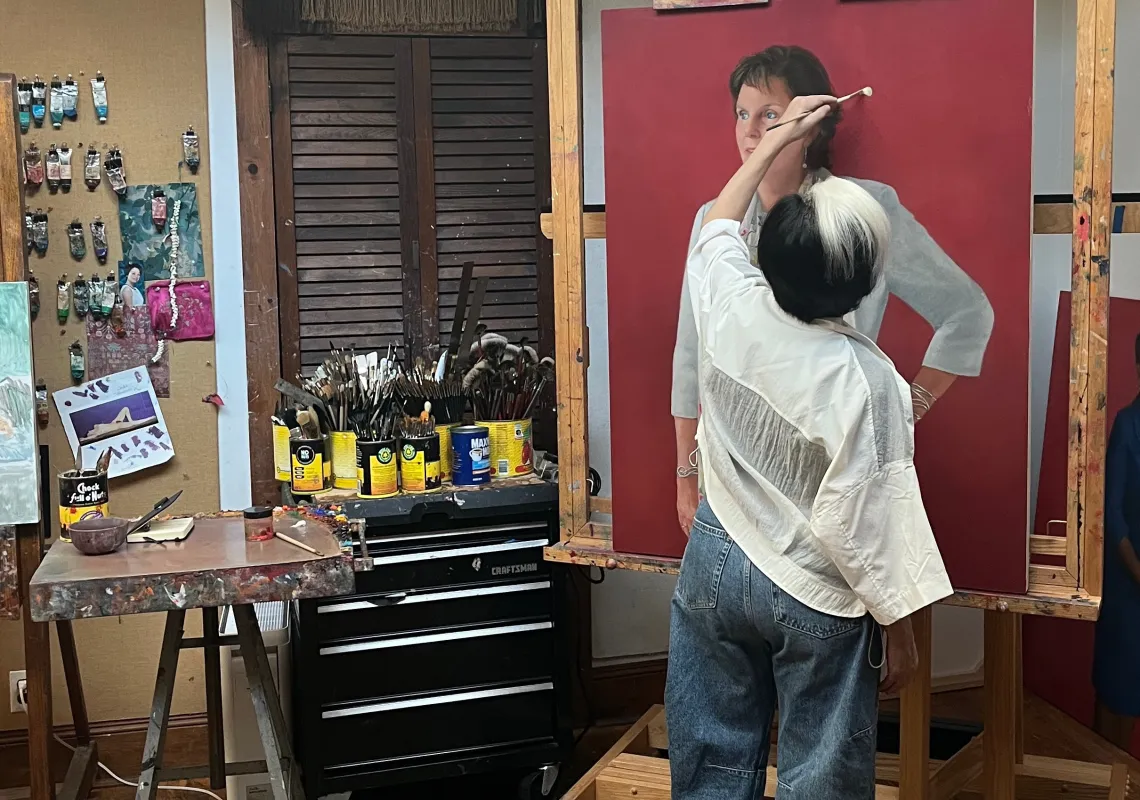 an artist working on a painting