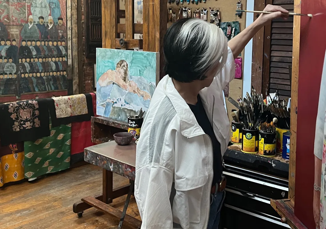 Artist Sharon Sprung painting
