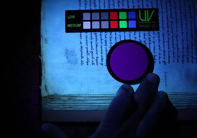 Looking for erased notations on Manuscript #4 using ultraviolet light