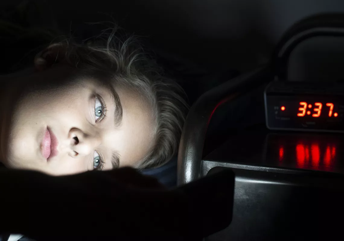 woman trying to fall asleep