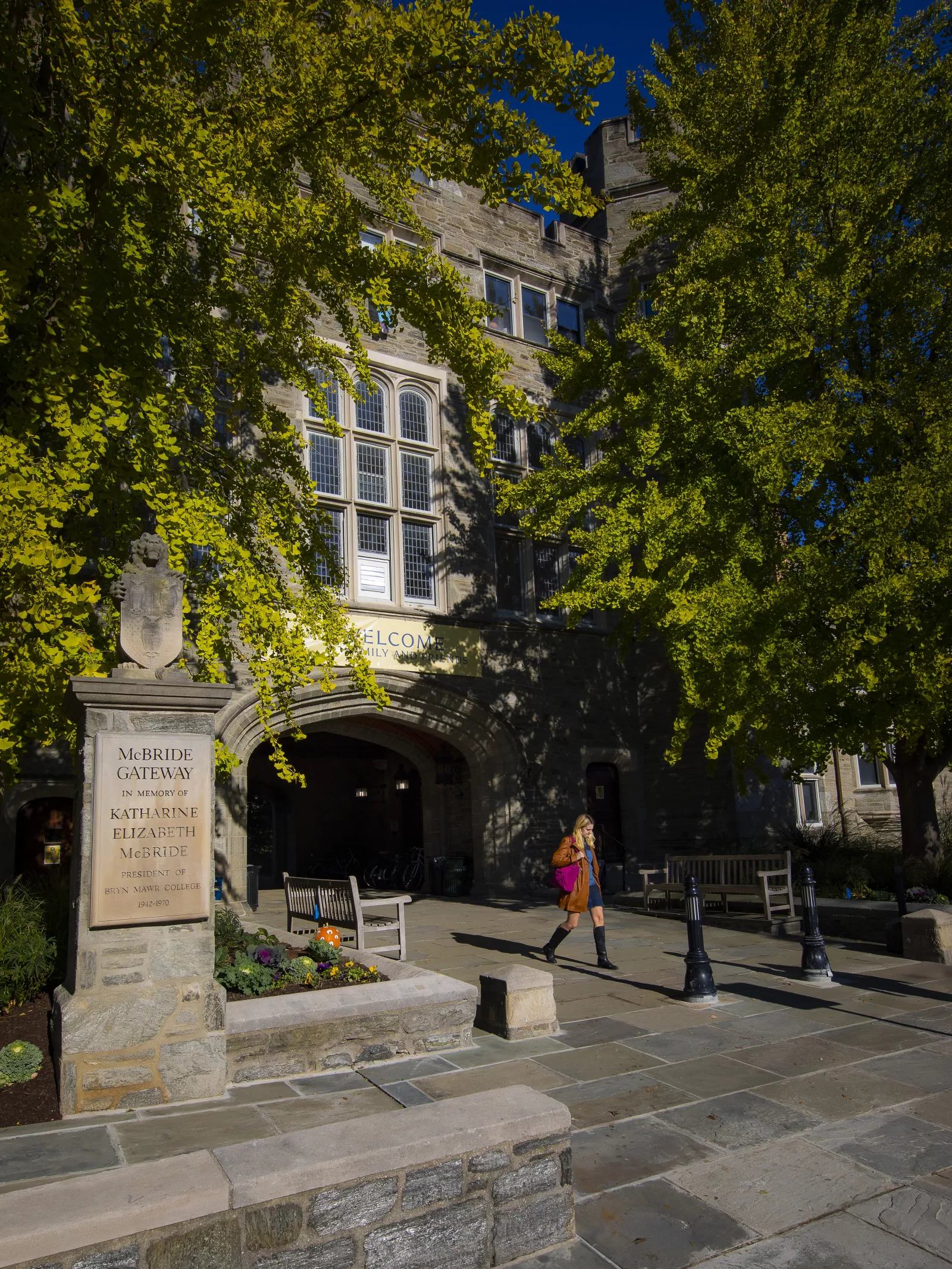 student walking through Pembroke Arch