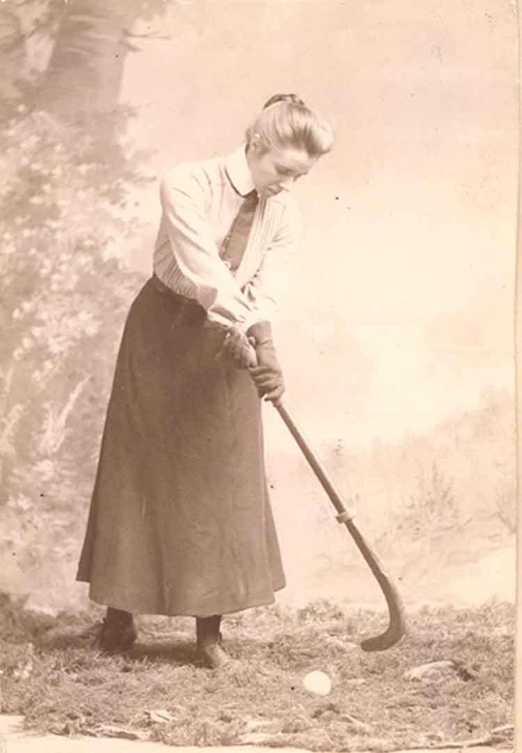 Constance Applebee holding a field hockey stick