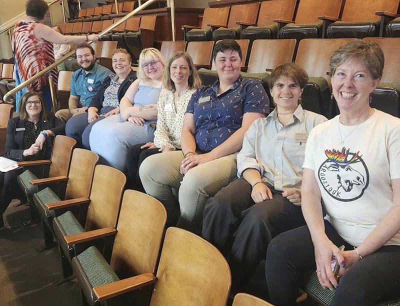 OUT Maine staff smiling and sitting in a row in an auditorium