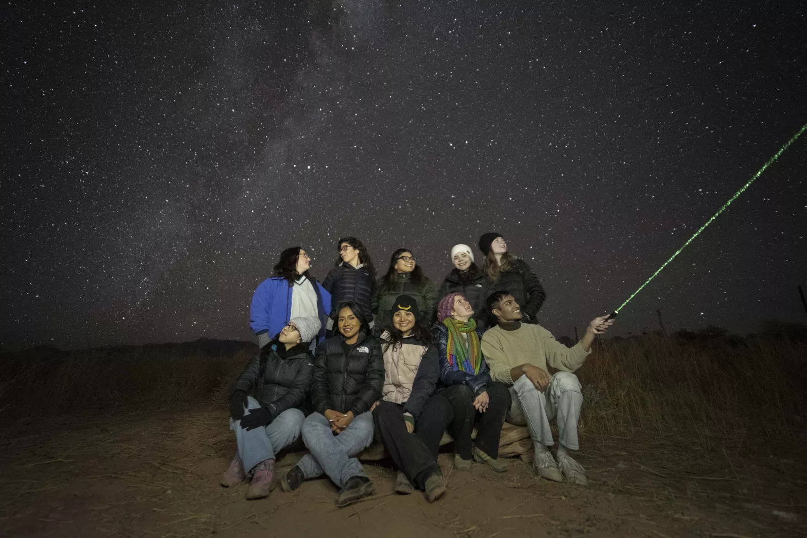 Group of people stargazing.