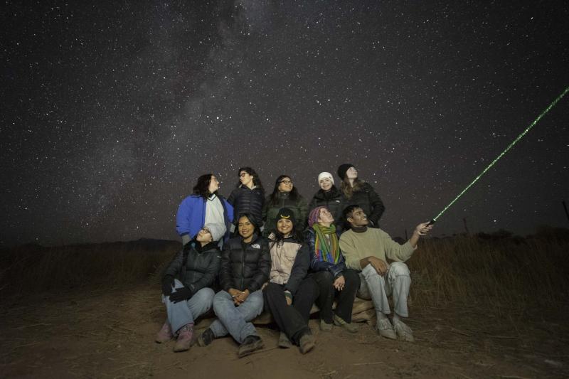 Group of people stargazing.