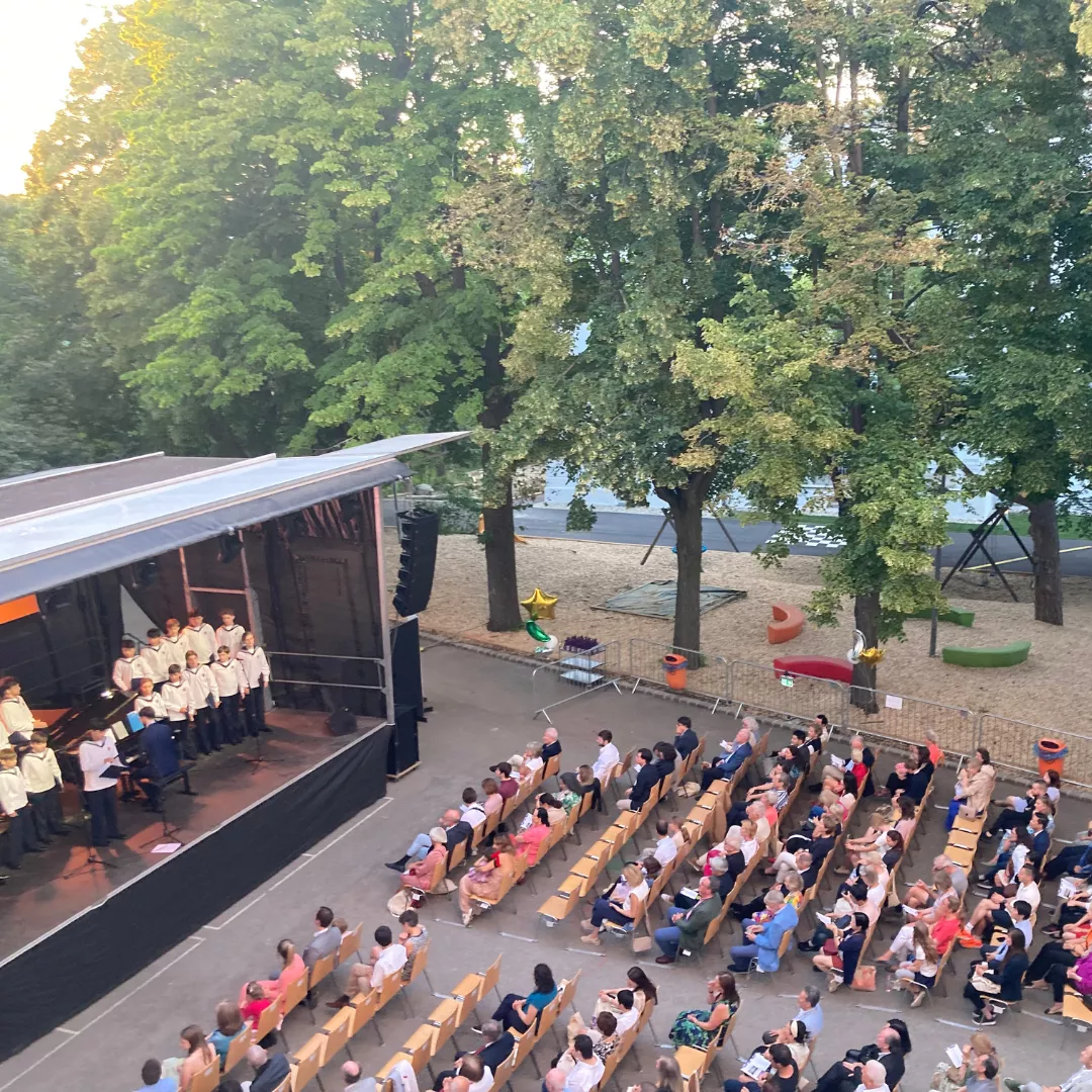 Audience seated at an outdoor music venue