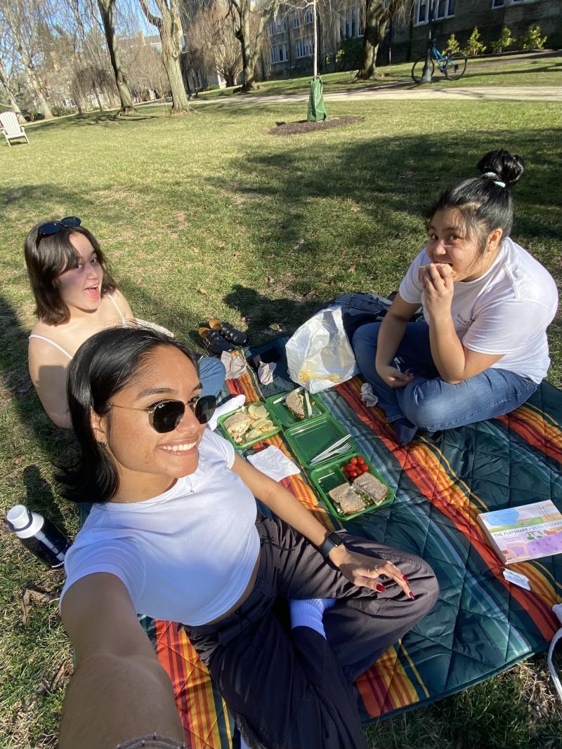Maggie Pavao, Leilani Soriano, and Gargi Nigam '25 have a picnic 
