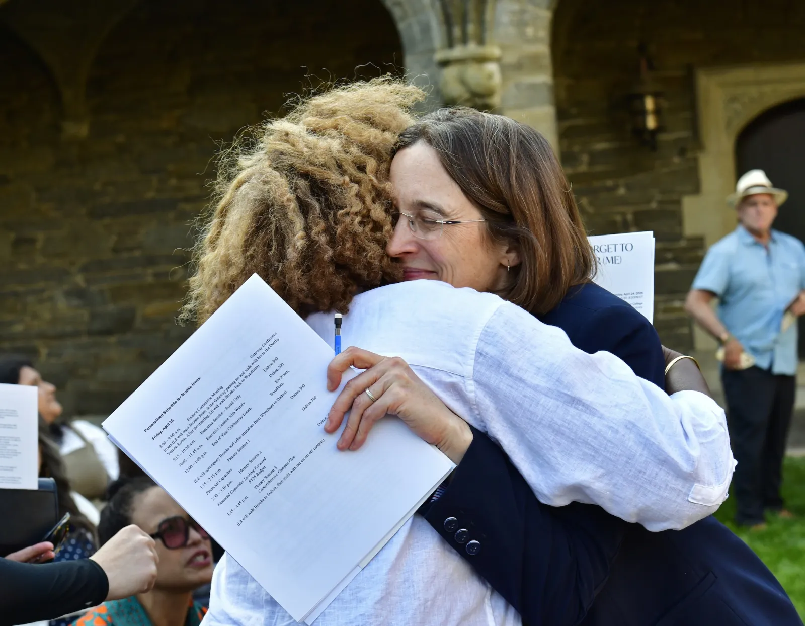 Wendy Cadge and Nekisha Durrett hug at the unveiling of "Don't Forget to Remember (Me)"