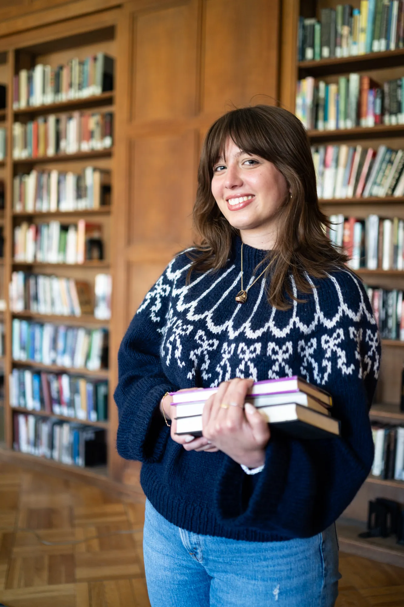 Claire holding books