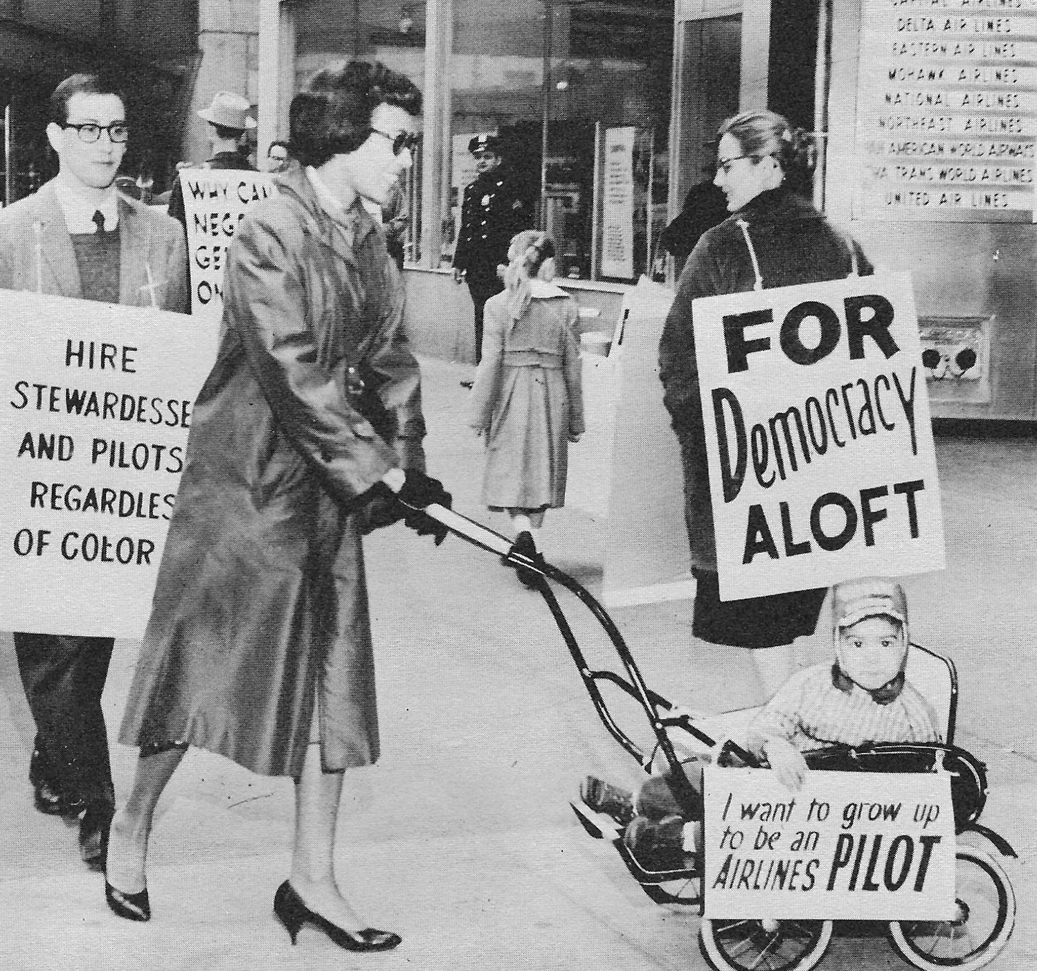Evie Rich on a picket line in 1960 with her son in a stroller.