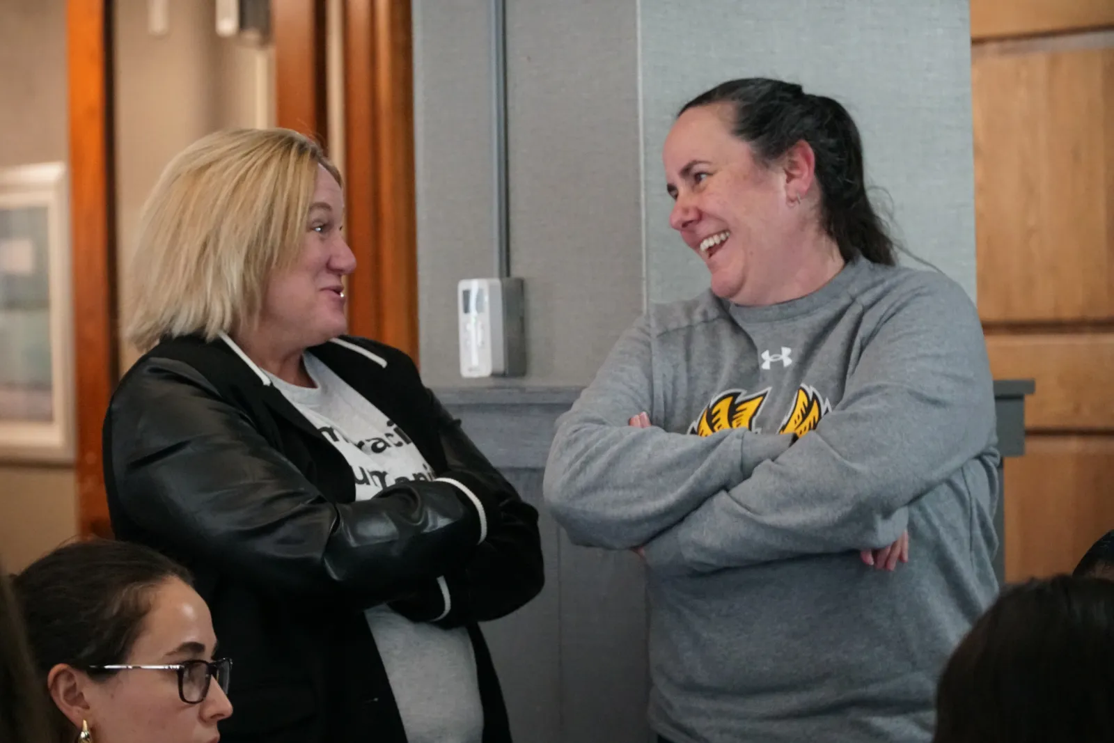 Katie Tarr talking with someone at the Snell-Shillingford Symposium