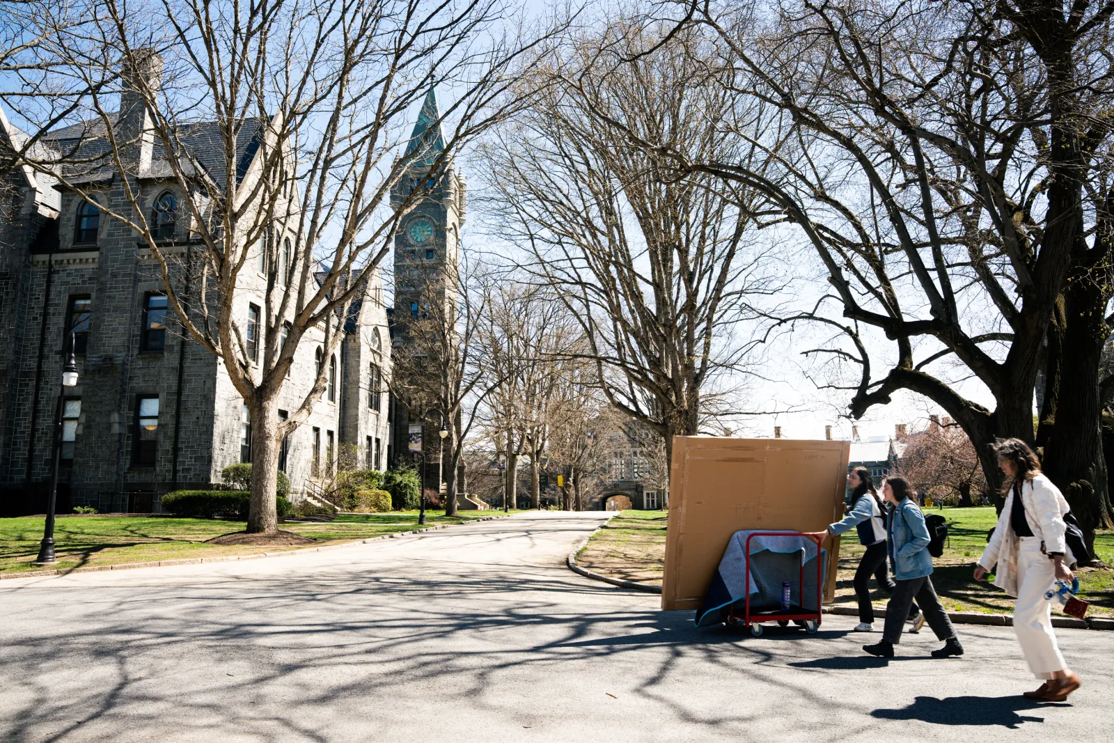 Katherine Bradford painting being transported to the Campus Center