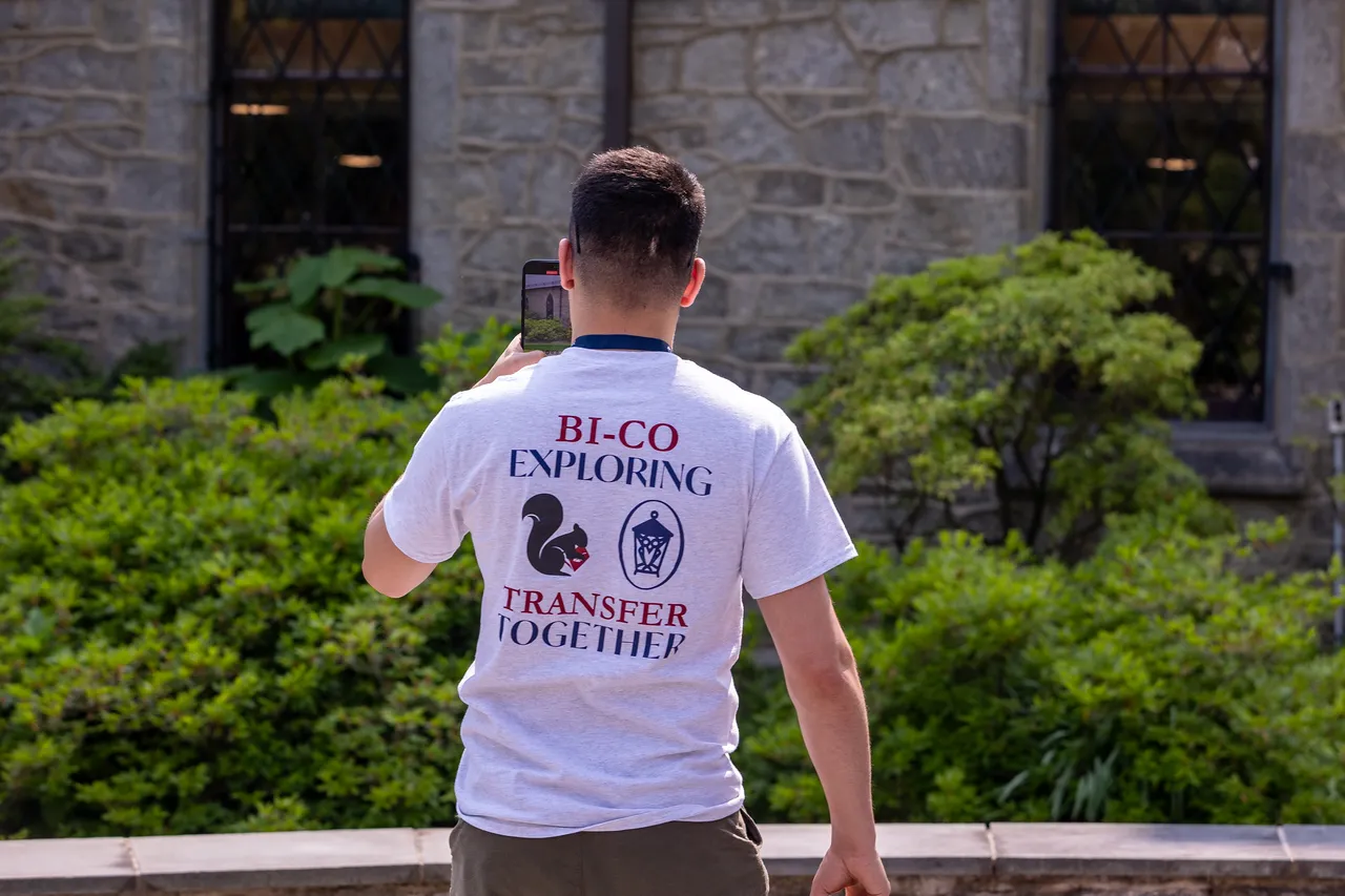 a student taking a photo while on a college tour