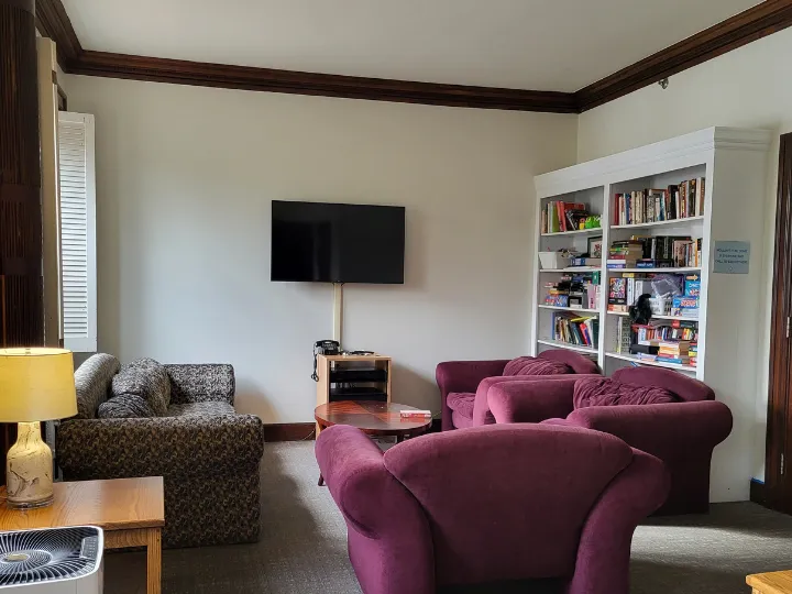 Empty Brecon common room with old furniture