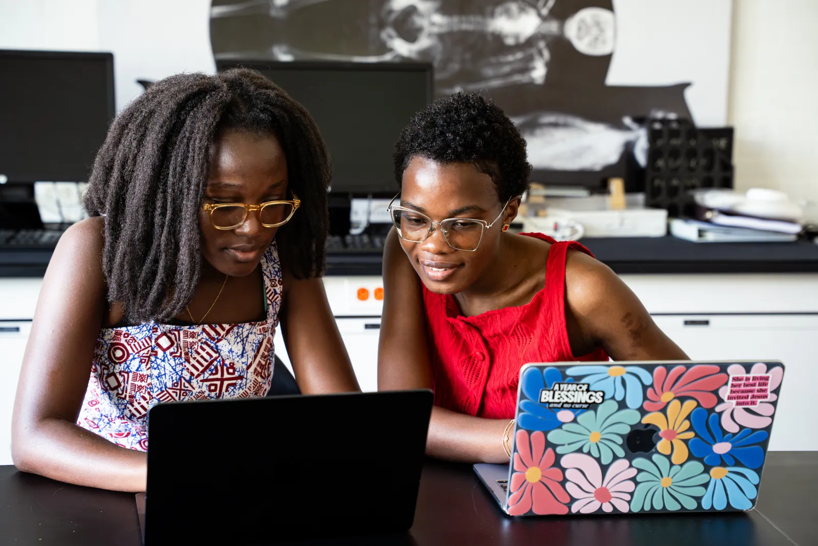 students looking at a laptop screen