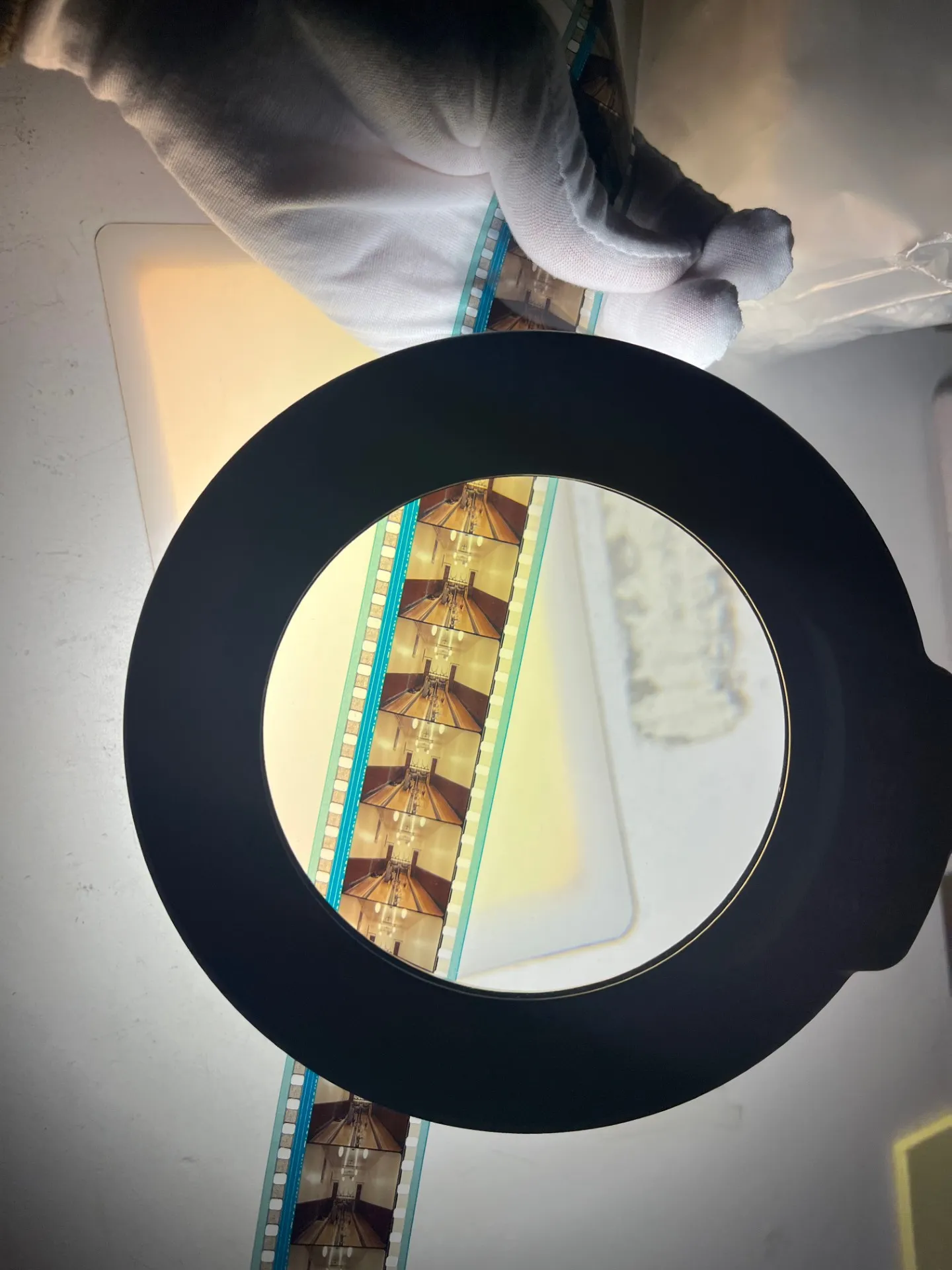 a film strip under a magnifying glass