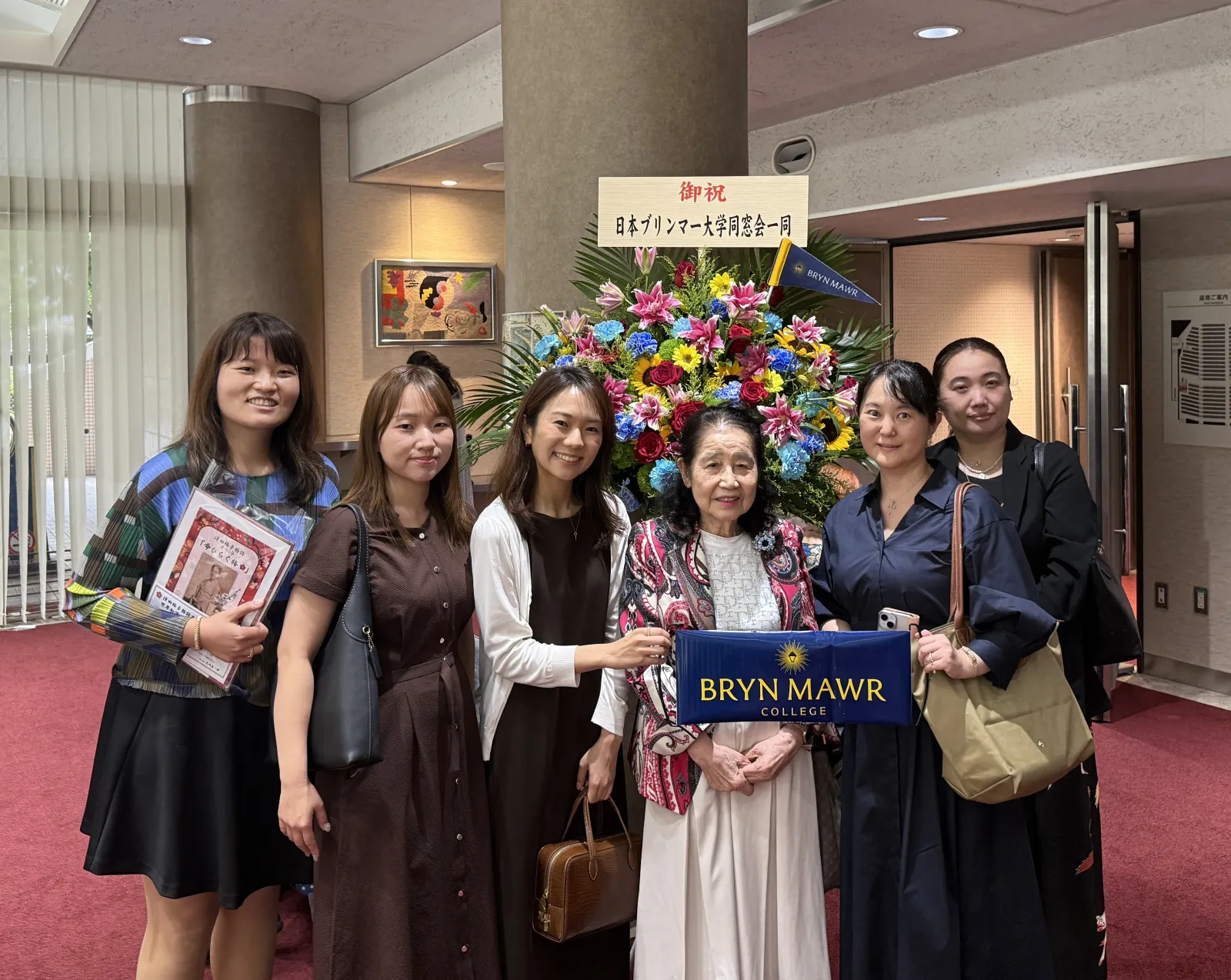The Bryn Mawr Club of Japan with a flower arrangement for the cast of the opera about Umeko Tsuda