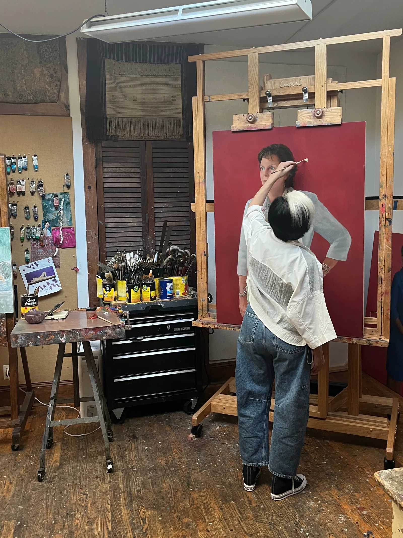 an artist working on a painting