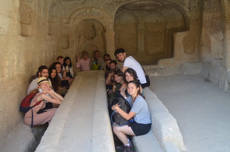 Elena and the group share a meal inside a Byzantine refectory