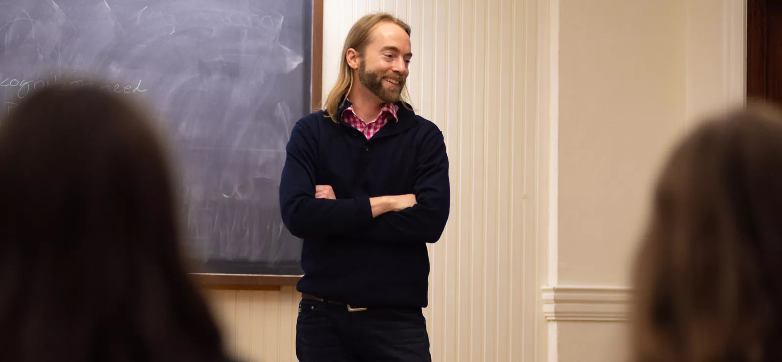 Joel Schlosser in classroom, engaging in research with students