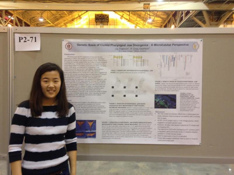 Lily Zogbaum in front of her poster presentation