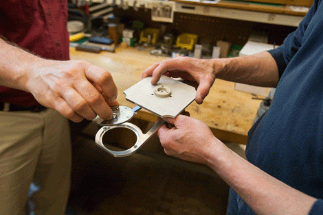 closeup of hands of staff working in the workshop