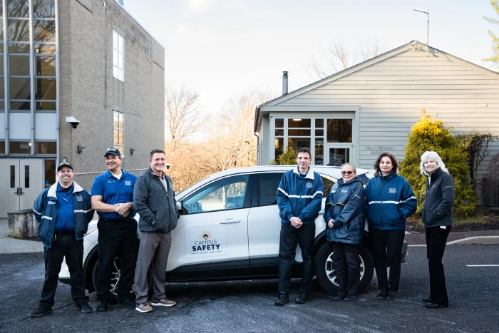 campus safety staff with a vehicle